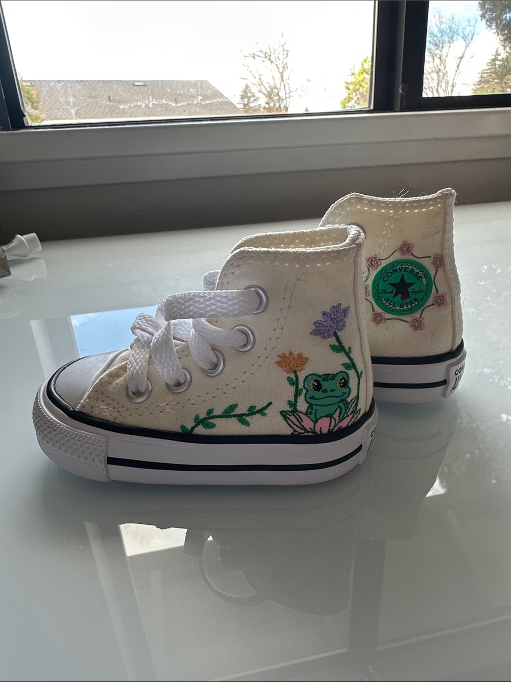 Brand new size 2 infant converse high top with cute frog and floral design